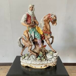 A large Italian faience porcelain Capodimonte pattarino “Arab on a horse” figure